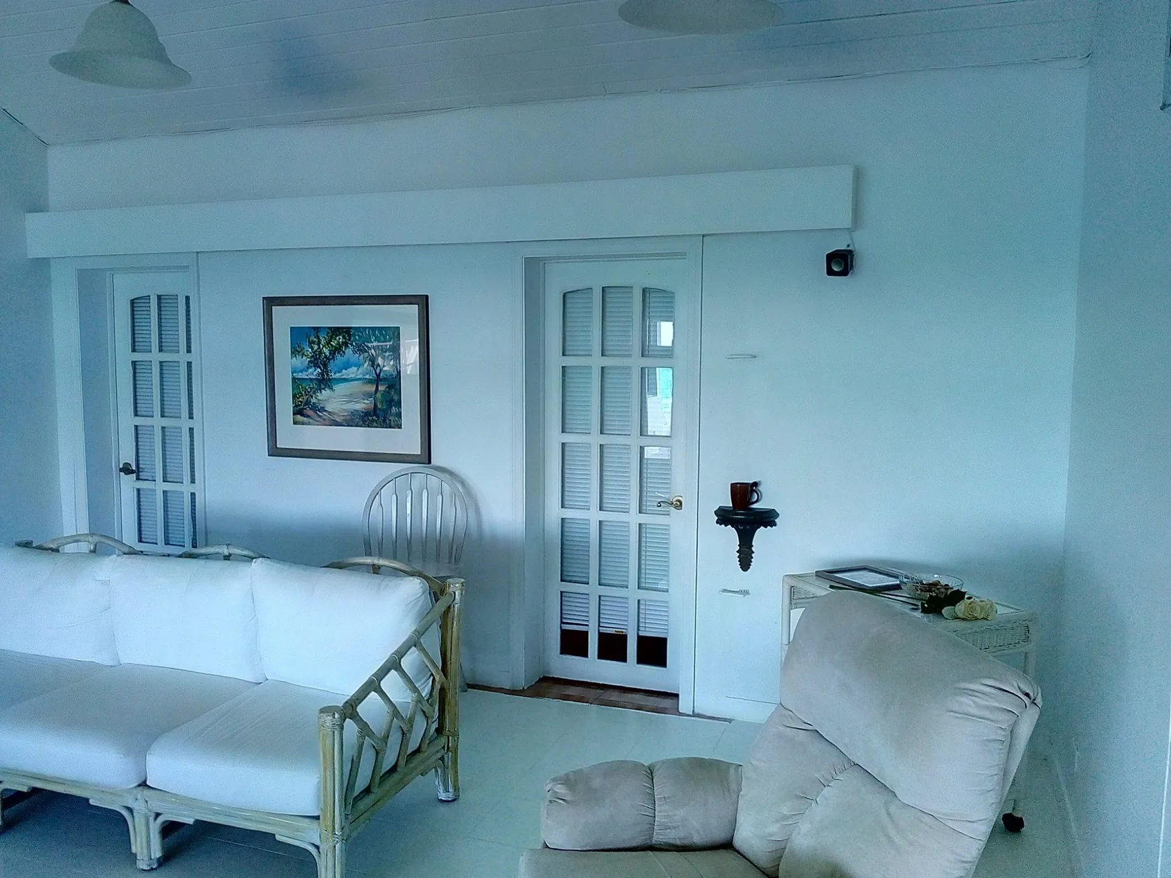 Completed living room with a wall-mounted television and concealed equipment