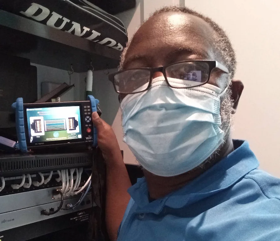 A technician testing and certifying a new network cabling installation