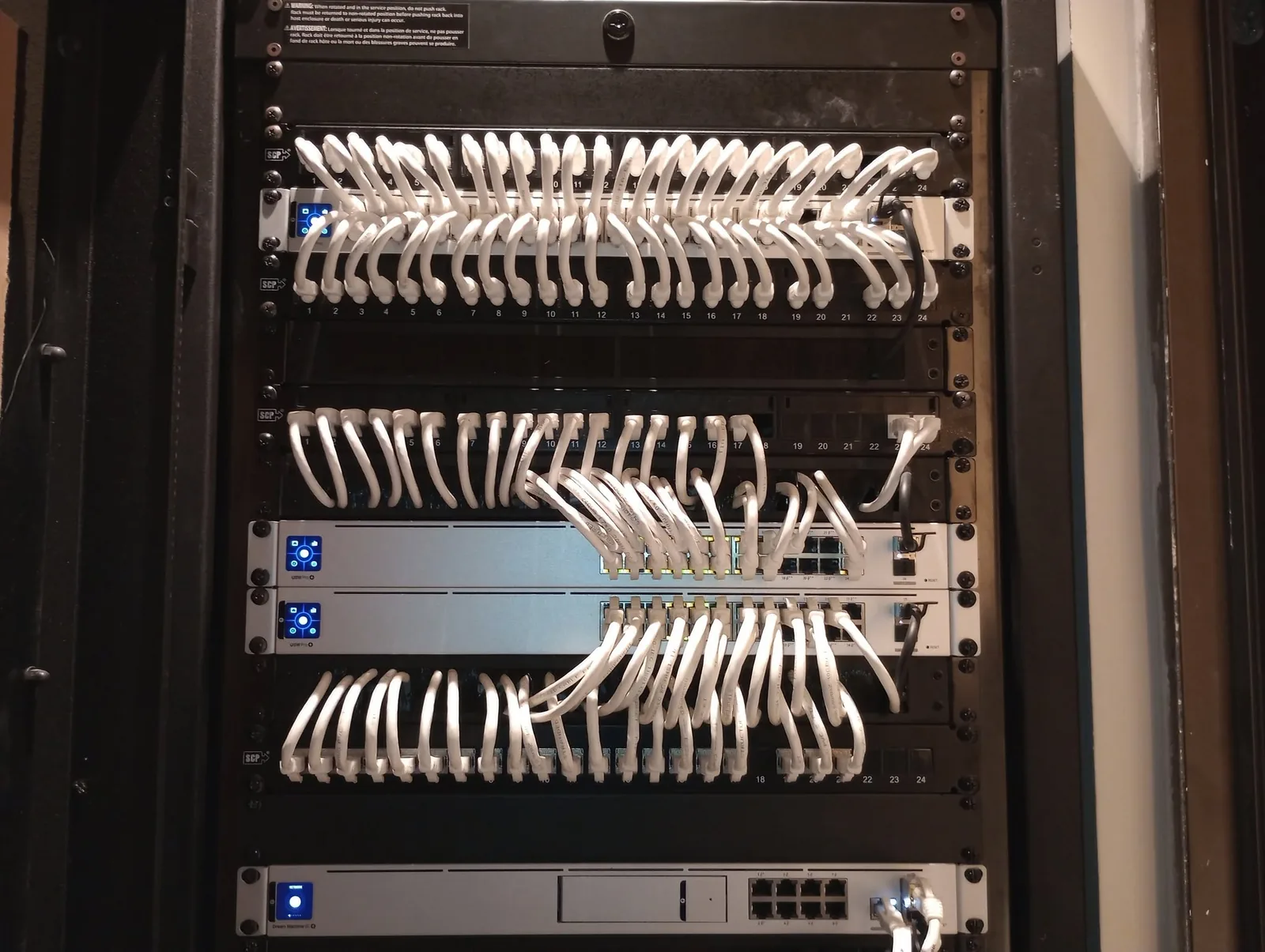 Completed rack with organized patch panels and structured cabling